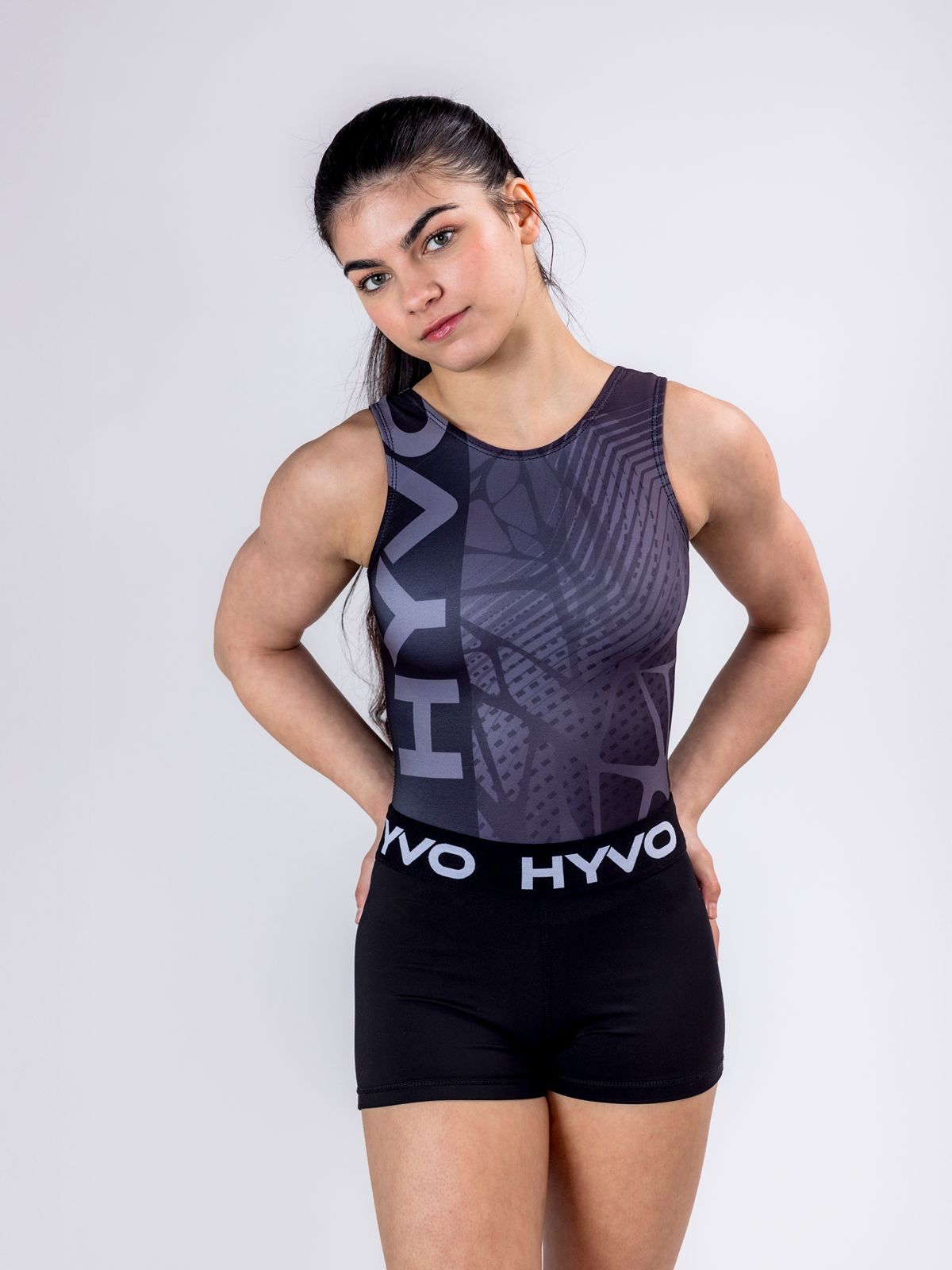 Front view of black girls gymnastics leotard from the HYVO Evolve range styled with black gymnastics shorts