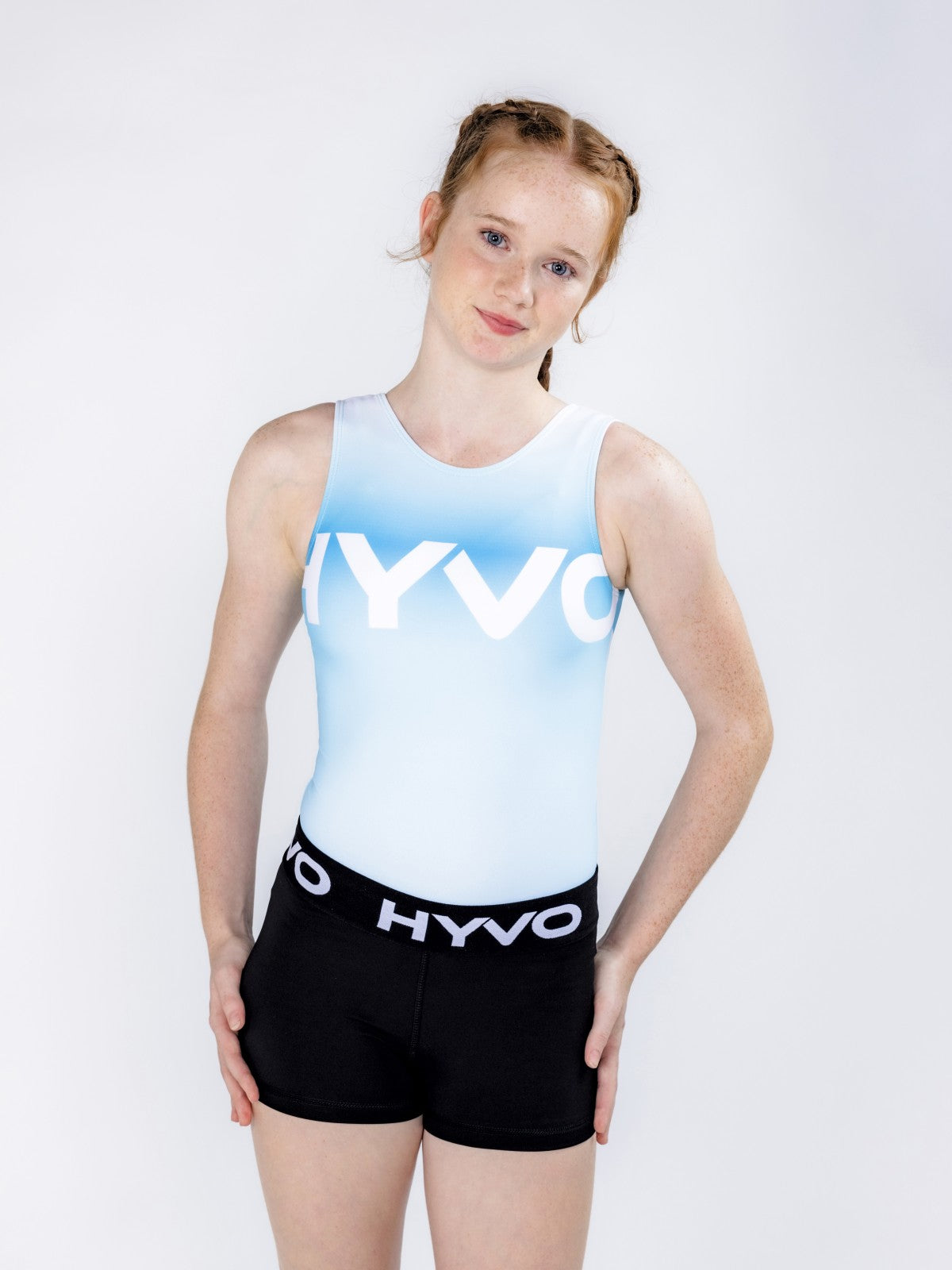 Front view of sweet mint girls gymnastics leotard from the HYVO Ascend range styled with gymnastics shorts